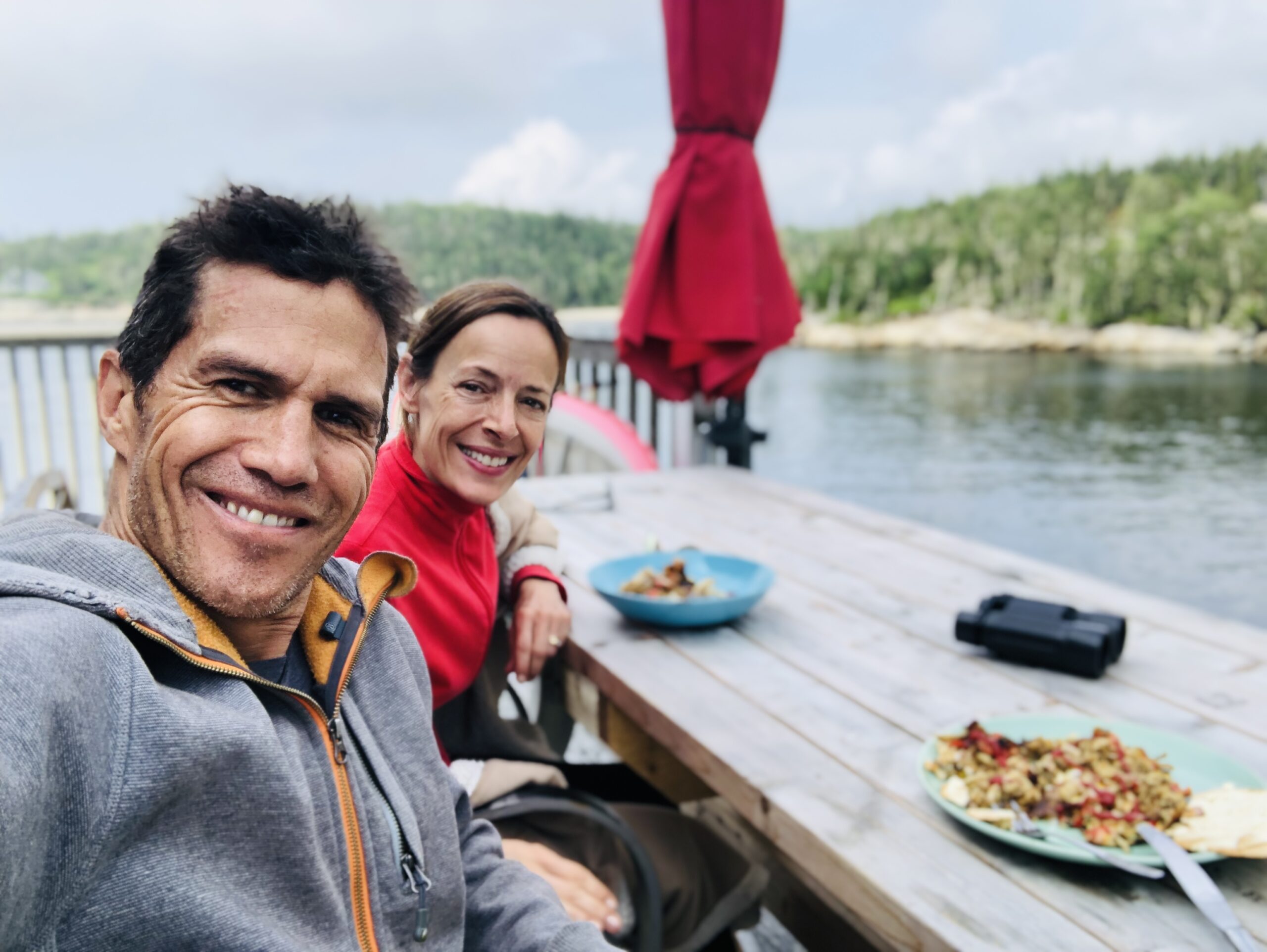 Life coaches Phil and Catherine Wall creating memorable moments having dinner on the ocean